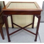 A mahogany display table, the hinged top with a glass panel, raised on square,