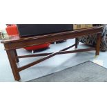 A modern mahogany finished coffee table, the top with canted corners,