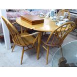 An Ercol beech and elm drop leaf breakfast table,