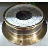 A modern lacquered brass cased bulkhead aneroid barometer 5.