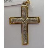 A 9ct and diamond set pendant cross 11