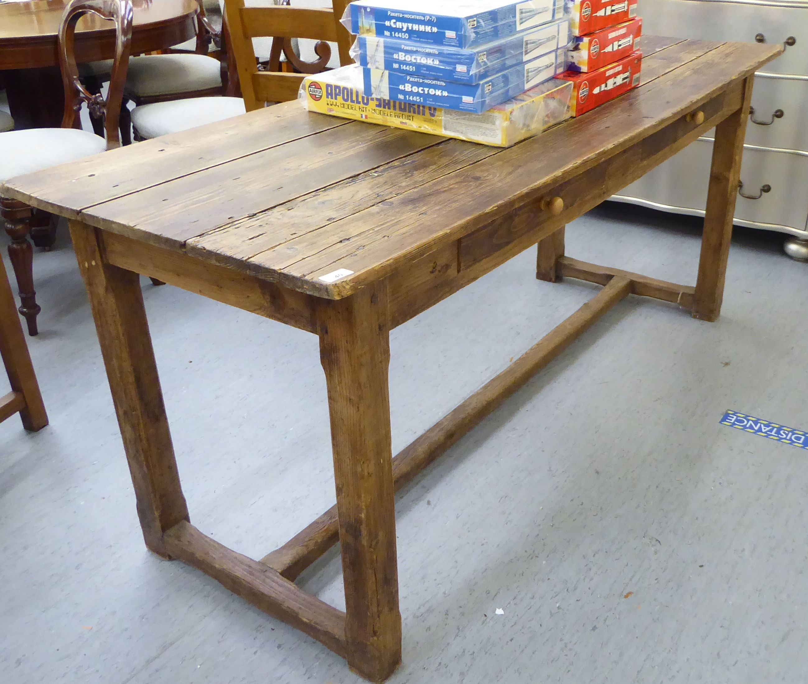 A 20thC rustically constructed pine farmhouse style kitchen table,