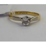 An 18ct gold claw set diamond solitaire ring 11