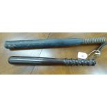 A blue painted wooden truncheon with a ribbed handgrip 18''L;