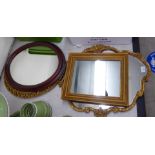 Four dissimilar mirrors of various sizes,