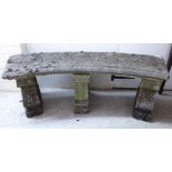 A composition stone garden seat,