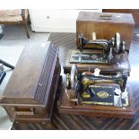 A Singer manual sewing machine with a domed mahogany cover; and a similar Perbad machine,