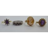 Four white and yellow metal rings: to include a 9ct gold cameo ring 11