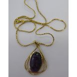 A 9ct gold gem set oval pendant,