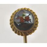 A yellow metal and Essex crystal stickpin,