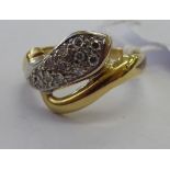 An 18ct gold diamond set snake ring 11