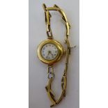 A lady's 18ct gold cased wristwatch, faced by an Arabic dial, on a sprung,