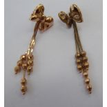 A pair of 9ct gold butterfly design drop earrings 11