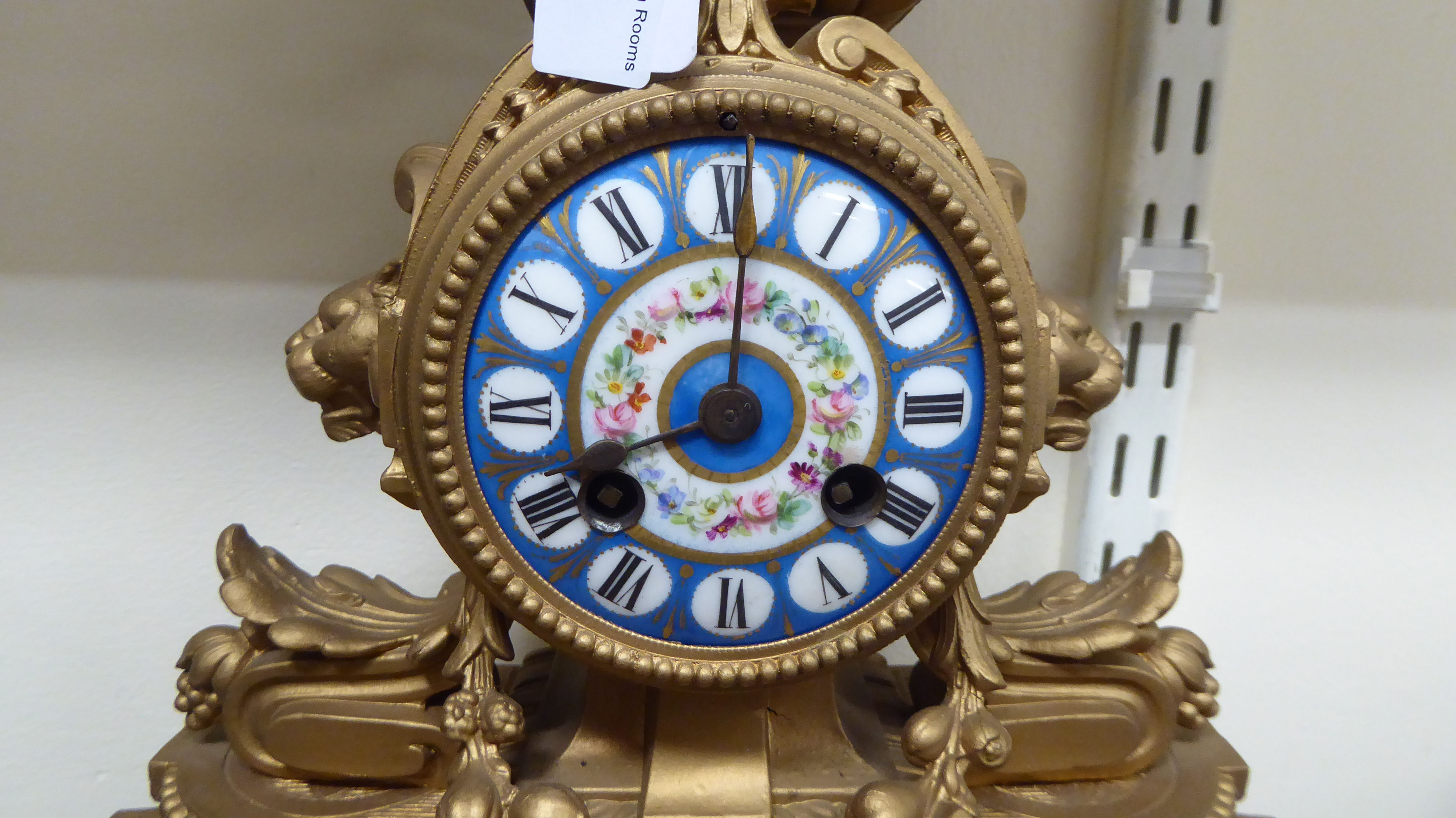 A late 19thC French gilded spelter cased mantel clock with inset, floral painted porcelain panels, - Image 2 of 4