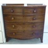 An early 19thC mahogany bow front dressing chest,