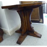 A Robert Thompson Mouseman burnished oak occasional table,