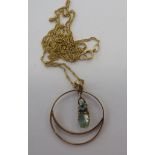 An 'antique' 9ct gold circular framed, gem set pendant,