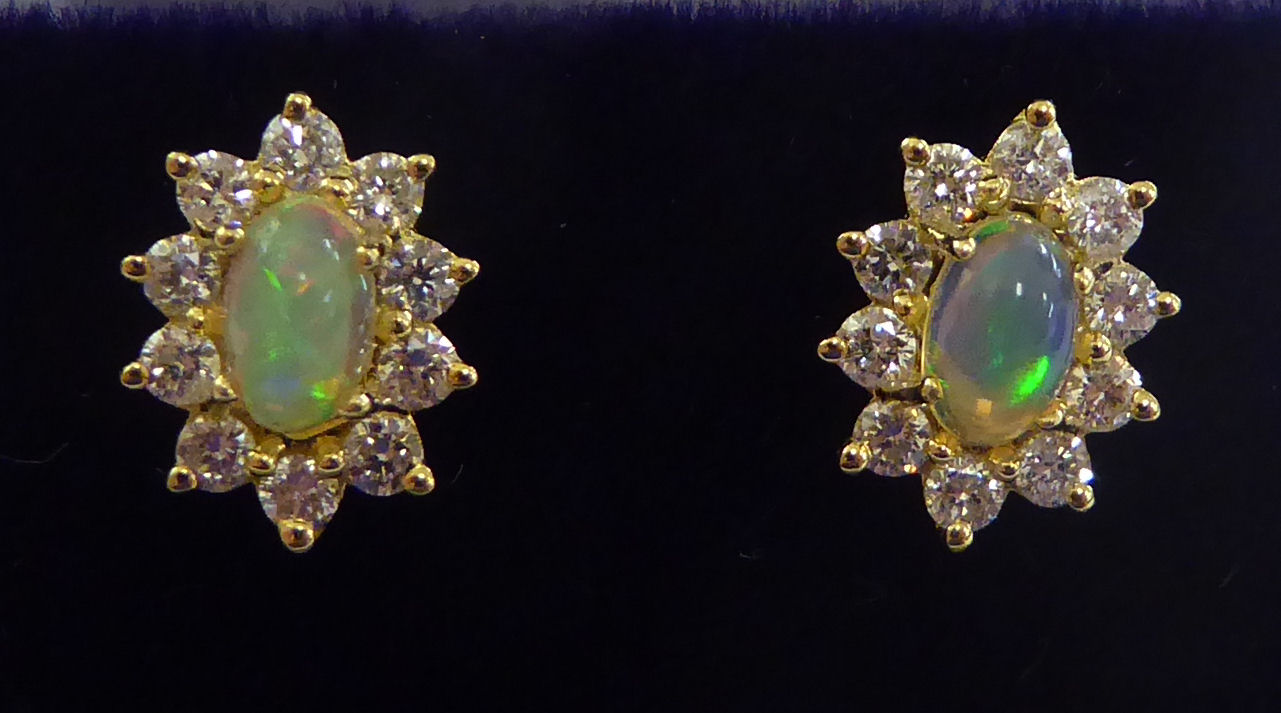 A pair of 18ct gold cluster earrings,