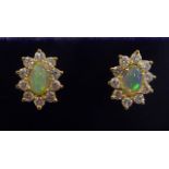 A pair of 18ct gold cluster earrings,