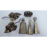 Three similar silver coloured metal perfume bottles with dippers;