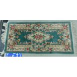 A washed woollen, possibly Wilton rug,