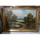 20thC British School - a landscape with trees by a lake oil on canvas 19'' x 29'' framed