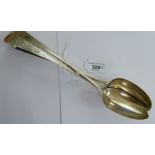 Three George III silver basting spoons, one with a bright-cut engraved stem London 1781,