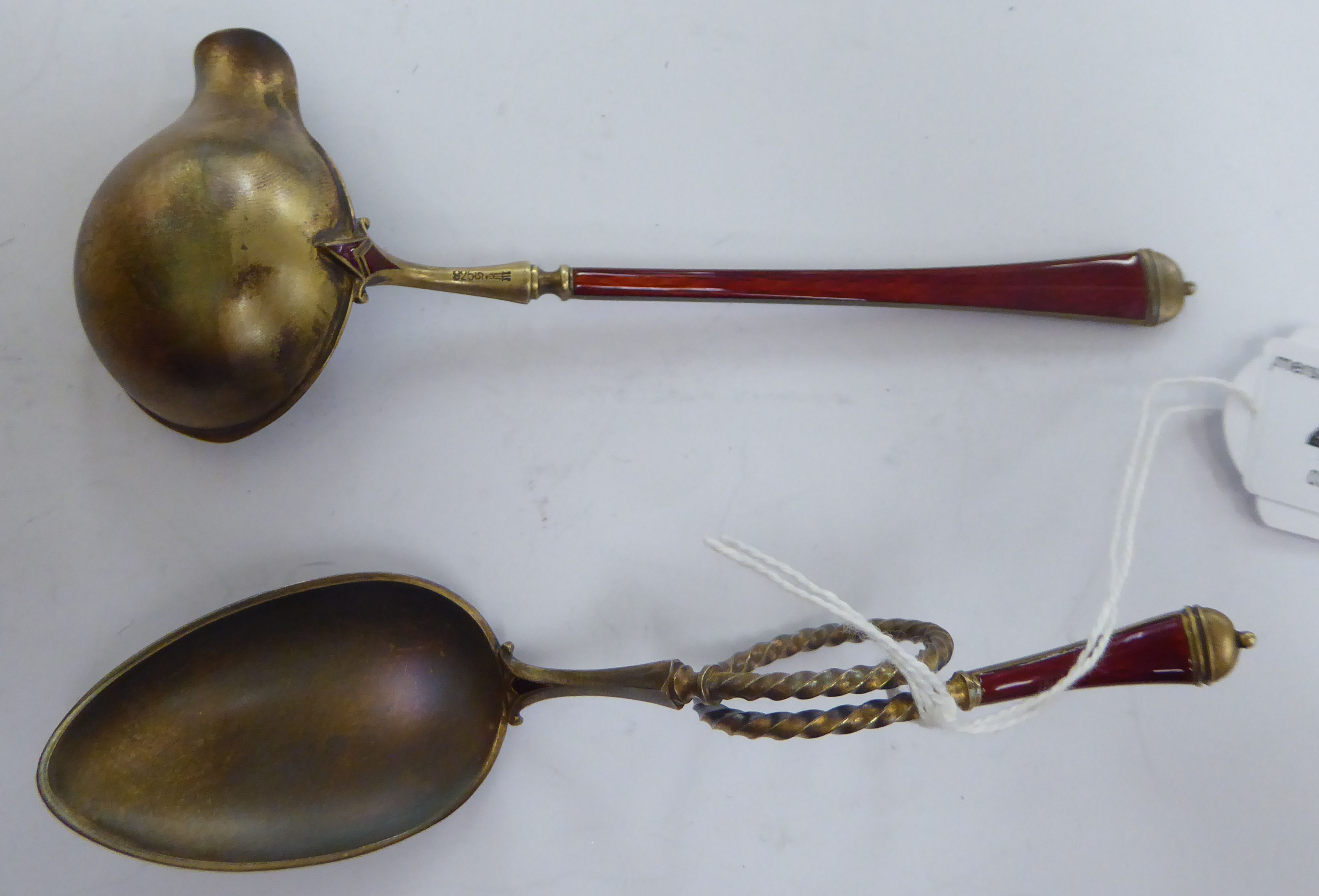 A Norwegian silver gilt and red enamel crucible and scrolled spoon stamped 925 in a presentation - Image 3 of 4