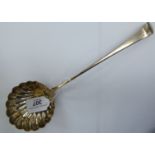 A George III silver Old English pattern ladle with a shell design circular bowl London 1782