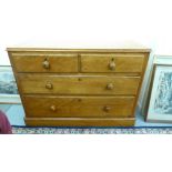 An early 20thC honey coloured pine dressing chest, the two short/two long drawers with bun handles,