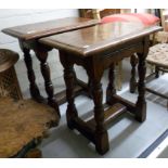 A pair of early 20thC stained oak joint stools, raised on turned, baluster and block legs,