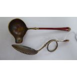 A Norwegian silver gilt and red enamel crucible and scrolled spoon stamped 925 in a presentation