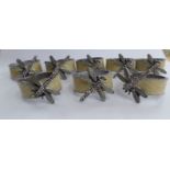 A set of eight modern steel and enamel napkin rings,