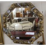 A modern mirror, the octagonal plate set in a gilt and silver sprayed frame,