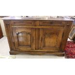 An early 19thC rustically constructed (possibly County made) hardwood dresser with two frieze