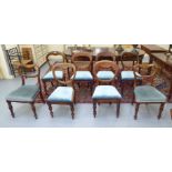 A matched set of eight late Victorian mahogany framed balloon back dining chairs with upholstered