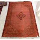 A Persian rug, decorated with diamond formation,