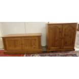 A modern honey coloured pine base cupboard,