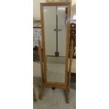 A modern waxed pine framed cheval mirror,