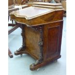 A late Victorian walnut serpentine front Davenport fitted with a covered stationery compartment,