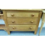 A modern light oak three drawer dressing chest with bun handles 31''h 38''w F