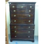 An early 19thC mahogany chest-on-chest, the upper part having a dentil moulded cornice,