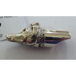 A silver dog's head whistle,