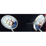 A pair of silver cufflinks,