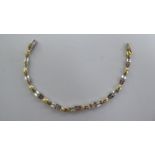 A 14ct bi-coloured gold and diamond set fancy link bracelet,