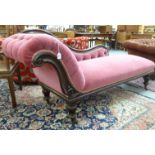 A late Victorian mahogany showwood framed chaise longue with an S-shaped back and scrolled end,