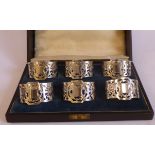 A set of six Sterling silver oval napkin rings with pierced and engraved decoration cased