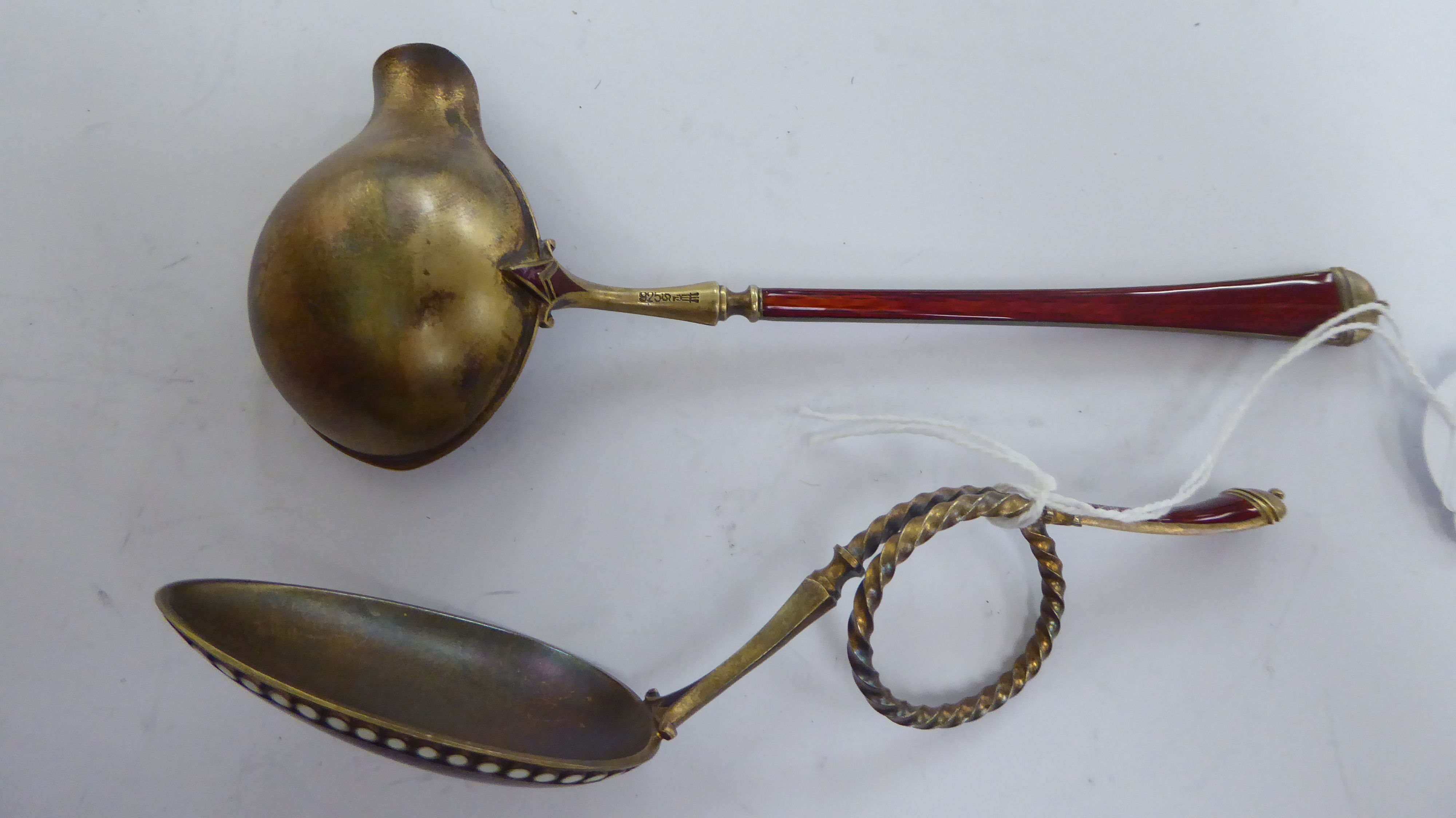A Norwegian silver gilt and red enamel crucible and scrolled spoon stamped 925 in a presentation - Image 2 of 4