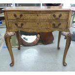 A Maple & Co figured walnut, serpentine front, two drawer canteen table, raised on foliate carved,