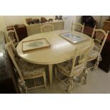 A modern cream wash painted extending dining table,